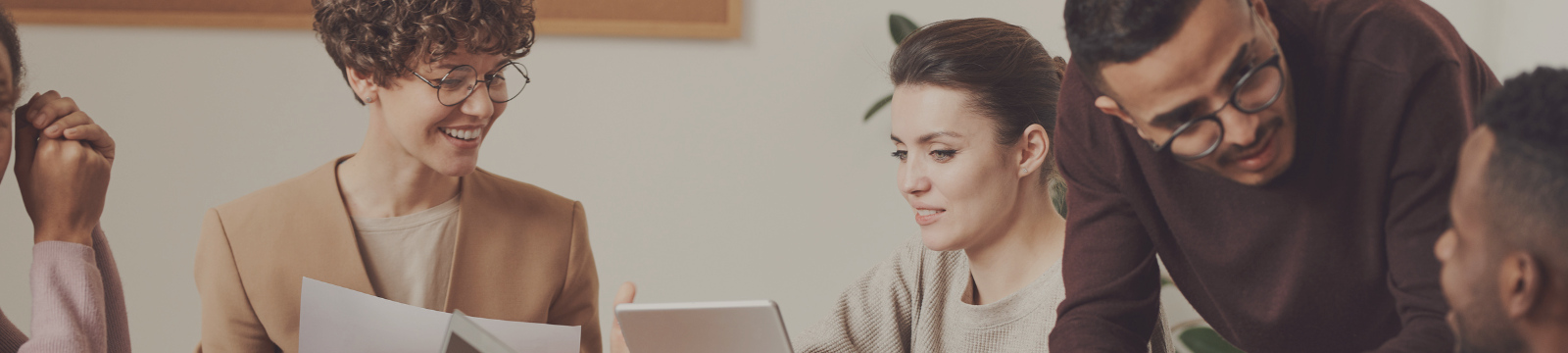 People gathered around talking and helping each other