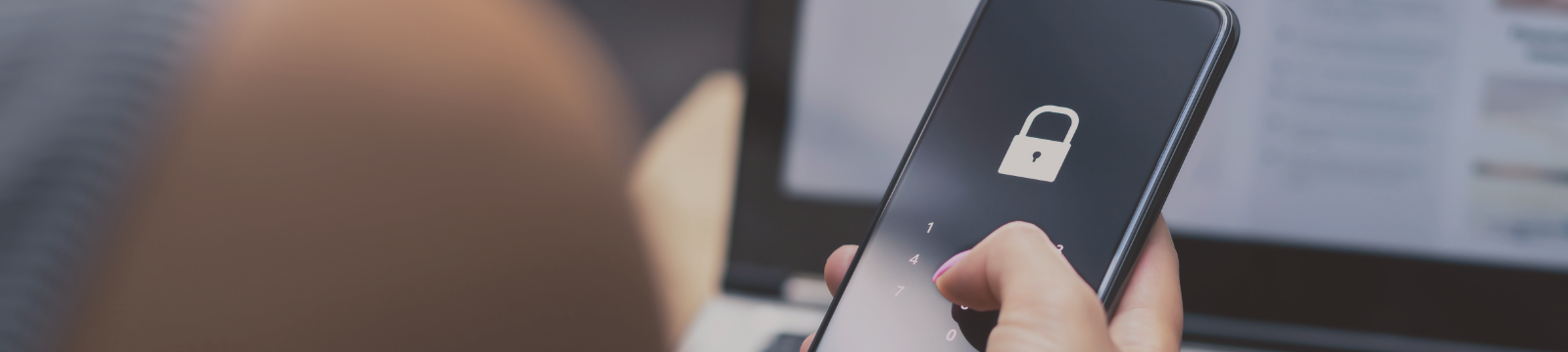 Person holding phone with a lock on it