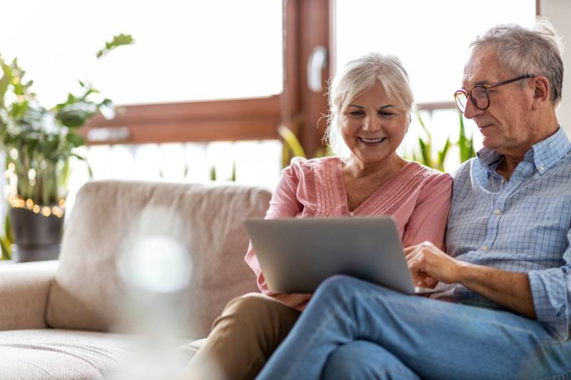 Older couple looking at the computer