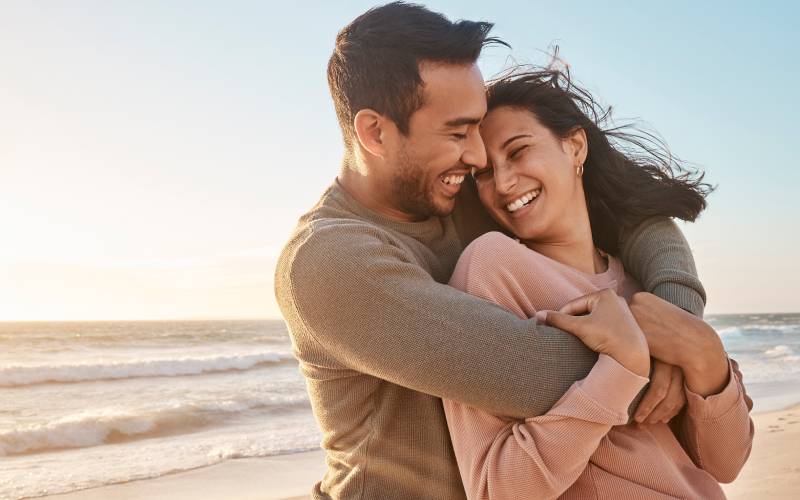 Couple on the beach smiling
