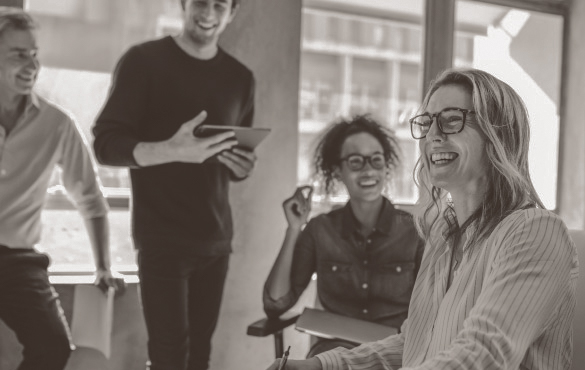 People laughing in a business meeting