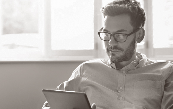 Man looking at a tablet