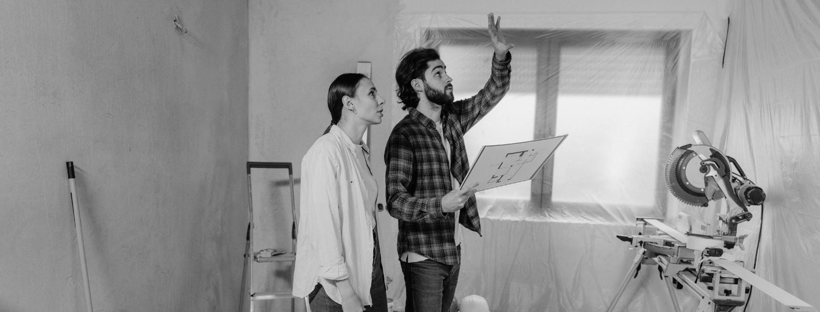 Man and Woman in a room under construction